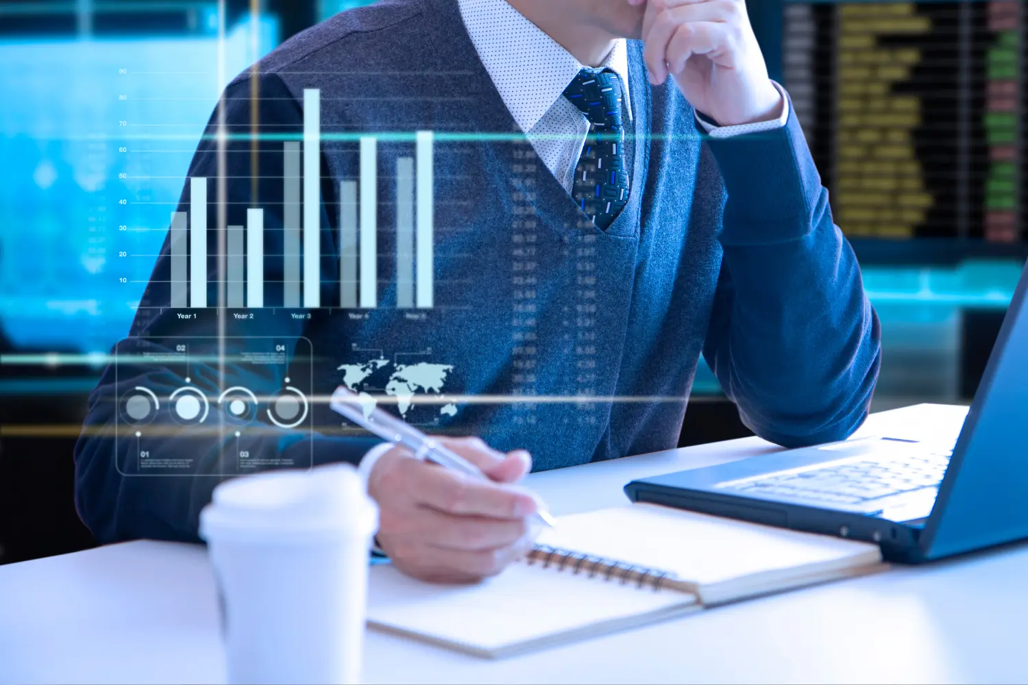 a man on a laptop with floating sem-transparent performance reports visible - Digitech