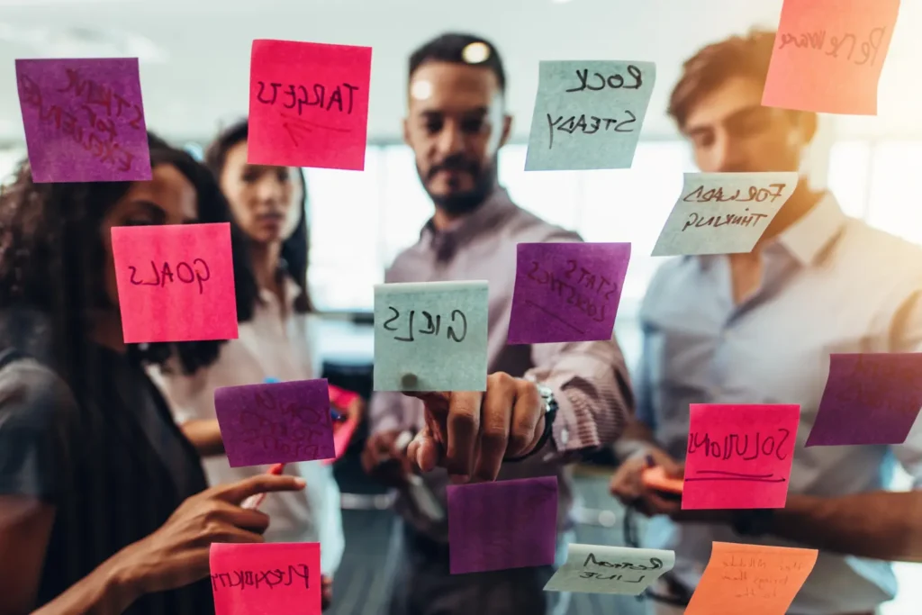 a team of content writers putting up postit notes - digitech